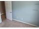 This carpeted room has a closet and light blue walls at 4175 Round Stone Dr, Snellville, GA 30039