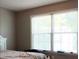 Neutral bedroom with a large bright window at 4175 Round Stone Dr, Snellville, GA 30039