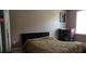 Bedroom features a bed with modern art, and a bright window at 4175 Round Stone Dr, Snellville, GA 30039