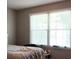Neutral bedroom with a large bright window at 4175 Round Stone Dr, Snellville, GA 30039