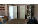 This is a cozy bedroom with taupe colored walls, a bookshelf, and two white doors at 4175 Round Stone Dr, Snellville, GA 30039