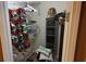 Image shows a walk-in closet with clothes hanging and additional storage spaces at 4175 Round Stone Dr, Snellville, GA 30039