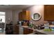 Functional kitchen with essential appliances, ample counter space, and wood cabinets at 4175 Round Stone Dr, Snellville, GA 30039