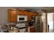 Well-equipped kitchen with appliances, ample counter space, refrigerator and wood cabinets at 4175 Round Stone Dr, Snellville, GA 30039