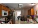 Open kitchen with stainless steel appliances and ample counter space with wood cabinets at 4175 Round Stone Dr, Snellville, GA 30039