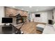 Finished basement with brick fireplace, desk, and comfortable seating area at 230 Summerfield Dr, Alpharetta, GA 30022
