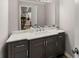 Bathroom featuring vanity with granite countertop, gray cabinets, modern fixtures and white sink at 230 Summerfield Dr, Alpharetta, GA 30022