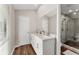 Bathroom features a double vanity with a marble countertop and glass shower with decorative tile at 230 Summerfield Dr, Alpharetta, GA 30022