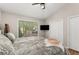 Comfortable bedroom featuring hardwood floors and a large window with natural light at 230 Summerfield Dr, Alpharetta, GA 30022