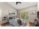 Comfortable bedroom with hardwood floors, a large window, and elegant decor at 230 Summerfield Dr, Alpharetta, GA 30022