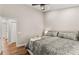 Comfortable bedroom with a ceiling fan and a well-lit space with hardwood floors at 230 Summerfield Dr, Alpharetta, GA 30022