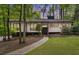 Charming one-story home with a landscaped front yard and mature trees at 230 Summerfield Dr, Alpharetta, GA 30022