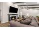 Spacious living room featuring a fireplace, exposed beams, and comfortable sectional sofa at 230 Summerfield Dr, Alpharetta, GA 30022
