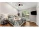 Bright main bedroom with a ceiling fan, a large window, and hardwood floors at 230 Summerfield Dr, Alpharetta, GA 30022