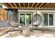 Covered outdoor patio featuring two hanging chairs and a small table at 230 Summerfield Dr, Alpharetta, GA 30022