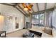 Relaxing screened-in porch with comfortable seating, ceiling fan, and views of the surrounding trees at 230 Summerfield Dr, Alpharetta, GA 30022
