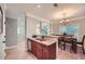 Open kitchen showcasing stainless steel appliances, granite countertops, and light wood floors at 2700 Pine Tree Ne Rd # 4003, Atlanta, GA 30324