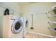 Laundry room with appliances and shelving for storage at 2700 Pine Tree Ne Rd # 4003, Atlanta, GA 30324