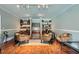 Spacious living room featuring hardwood floors, stylish furniture, and built-in shelving, perfect for relaxing and entertaining guests at 2700 Pine Tree Ne Rd # 4003, Atlanta, GA 30324
