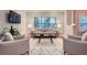 Modern living room with large window, stylish seating, and decorative accents at 2700 Pine Tree Ne Rd # 4003, Atlanta, GA 30324