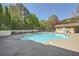 Sparkling community pool with ample space for relaxation, surrounded by mature trees providing shade and privacy at 2700 Pine Tree Ne Rd # 4003, Atlanta, GA 30324