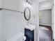 This bathroom features a modern sink, mirror, and a view to another room at 3795 Willowbrook Dr, Douglasville, GA 30135