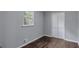 Bedroom with a window offering natural light and a closet with bifold doors at 3795 Willowbrook Dr, Douglasville, GA 30135