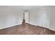 Spacious bedroom with wood-look floors, white walls, and a large closet with paneled doors at 3795 Willowbrook Dr, Douglasville, GA 30135