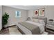 Bright bedroom featuring hardwood floors, neutral walls, modern decor, and natural light from the window at 3795 Willowbrook Dr, Douglasville, GA 30135