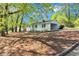 This charming home features a convenient carport and lovely landscaping at 3795 Willowbrook Dr, Douglasville, GA 30135