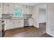 Eat-in kitchen area with white cabinets, stainless appliances, and updated countertops at 3795 Willowbrook Dr, Douglasville, GA 30135
