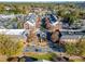 An aerial view showcases a commercial district with well-maintained buildings, parking lots, and mature trees around at 503 Madison Se Ct, Smyrna, GA 30080