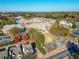 An aerial view displays a school campus surrounded by trees, with well-maintained playgrounds and athletic fields at 503 Madison Se Ct, Smyrna, GA 30080