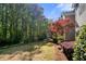 Beautiful landscaped backyard with mature trees and lush greenery at 503 Madison Se Ct, Smyrna, GA 30080