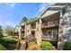 A beautiful condominium exterior with stone and wood and multiple porches at 503 Madison Se Ct, Smyrna, GA 30080