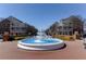 Large, tiered fountain surrounded by a brick plaza with nearby buildings adding charm and community appeal at 503 Madison Se Ct, Smyrna, GA 30080