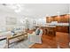 Spacious living room with hardwood floors seamlessly connects to the dining and kitchen areas at 503 Madison Se Ct, Smyrna, GA 30080
