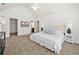 Bright main bedroom featuring vaulted ceiling, neutral colors, carpet floors, and walk-in closet at 503 Madison Se Ct, Smyrna, GA 30080