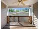 View of a covered patio with a ceiling fan overlooking the community at 503 Madison Se Ct, Smyrna, GA 30080