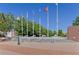 Well-maintained plaza with flag poles, accessible ramps, and brick accents, surrounded by lush greenery at 503 Madison Se Ct, Smyrna, GA 30080