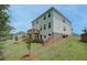 The backyard features a spacious lawn and an elevated wooden deck at 540 Teversham Dr, Mcdonough, GA 30253
