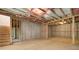 Unfinished basement with concrete flooring and wooden framing with stairs leading upstairs at 540 Teversham Dr, Mcdonough, GA 30253