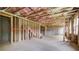 Unfinished basement with wooden framing, concrete flooring, and visible insulation at 540 Teversham Dr, Mcdonough, GA 30253