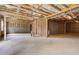 Unfinished basement with concrete floor and exposed wooden framing, ready to be customized at 540 Teversham Dr, Mcdonough, GA 30253
