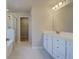 Bright bathroom featuring a double vanity, walk-in shower, and neutral color palette at 540 Teversham Dr, Mcdonough, GA 30253