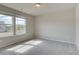 Sun-filled bedroom with neutral carpet, two windows and serene natural light at 540 Teversham Dr, Mcdonough, GA 30253