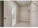 Walk-in closet with carpet flooring and wire shelving system at 540 Teversham Dr, Mcdonough, GA 30253