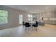 Bright dining area featuring modern light fixture, table and view to the kitchen at 540 Teversham Dr, Mcdonough, GA 30253