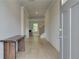 Inviting entryway with hardwood floors, natural light, and an open view to the living area at 540 Teversham Dr, Mcdonough, GA 30253