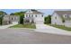 Charming two-story home with manicured lawn, porch, and an attached two car garage at 540 Teversham Dr, Mcdonough, GA 30253